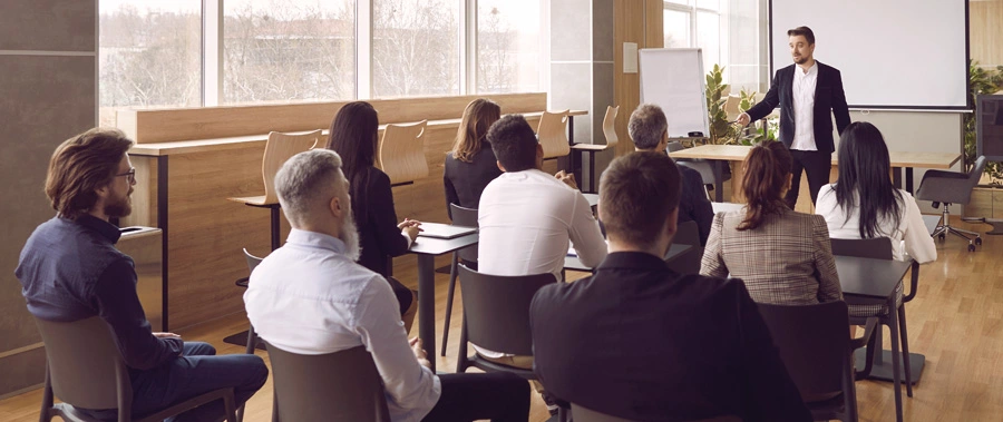 Group of people listening to a speaker