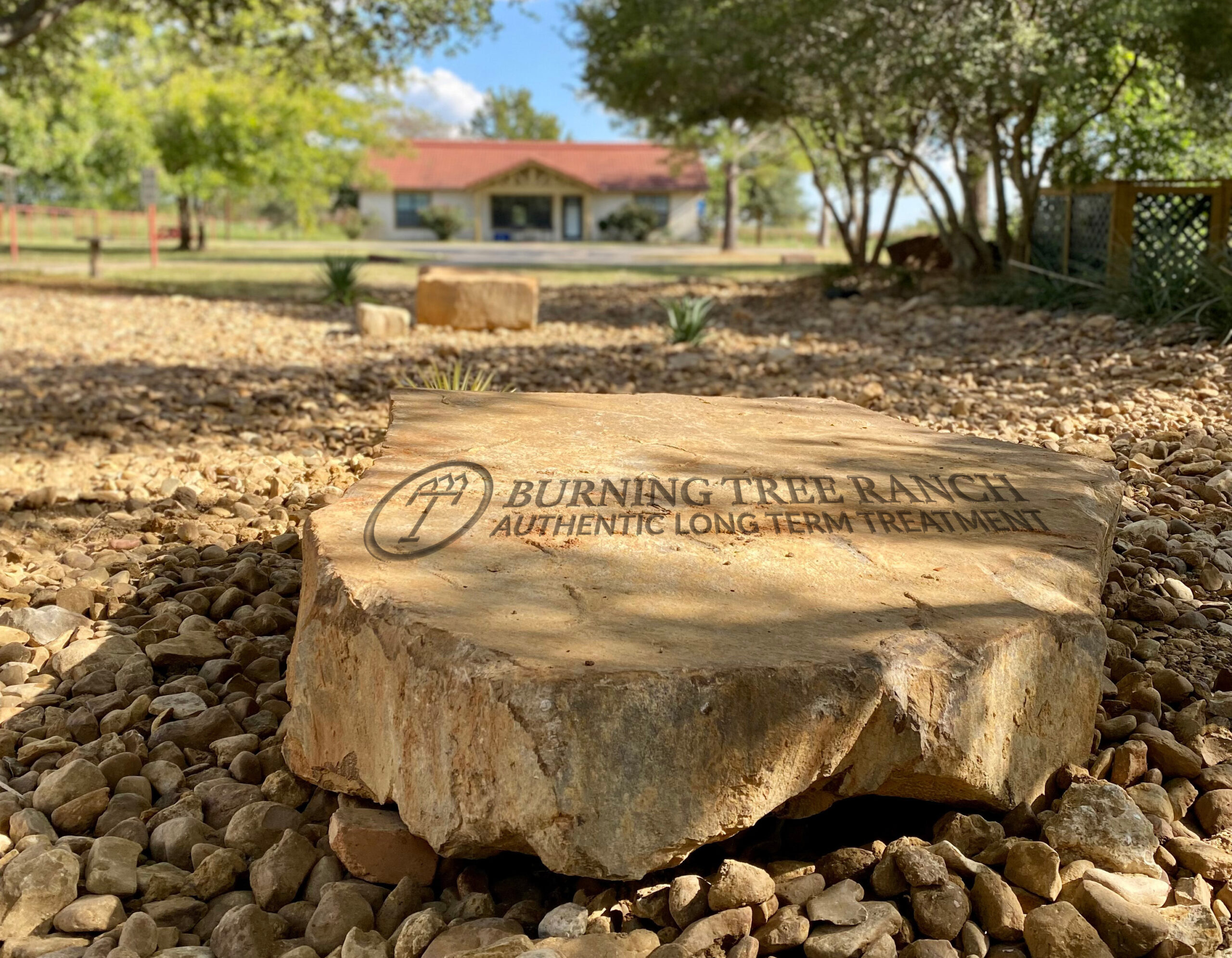 Photo of Engraved Rock with the Burning Tree Ranch Logo