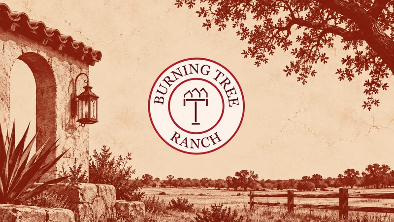 Illustrated Burning Tree Ranch emblem with a lantern-lit arch, agave, and a fenced pasture in burgundy tones